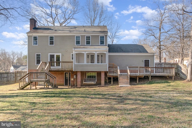 back of house with a yard and a deck