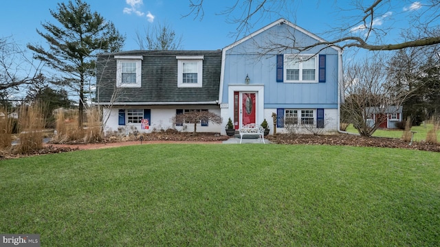 raised ranch featuring a front lawn