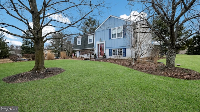 raised ranch with a front lawn