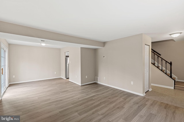 spare room featuring light hardwood / wood-style flooring