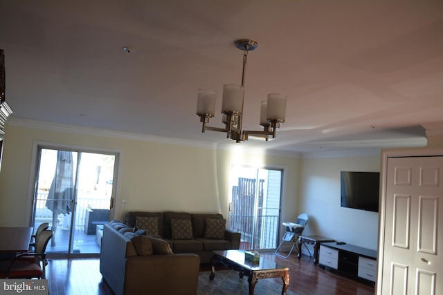 living room with ornamental molding, dark hardwood / wood-style flooring, and a chandelier