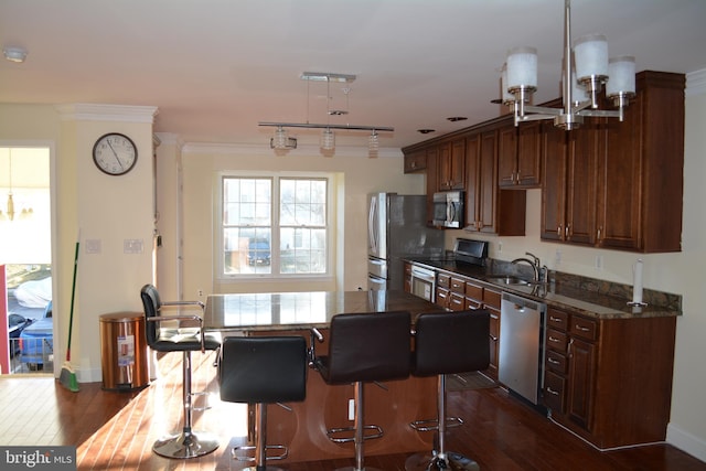 kitchen with stainless steel appliances, crown molding, sink, and dark hardwood / wood-style flooring