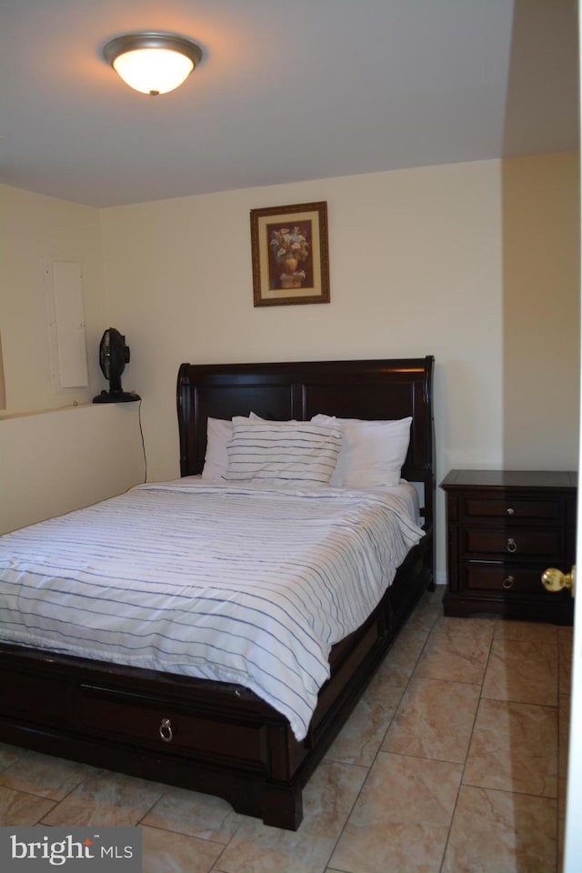 bedroom featuring light tile patterned floors