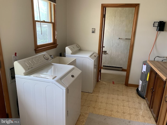 clothes washing area with sink and washing machine and dryer