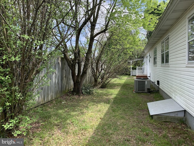 view of yard with central air condition unit