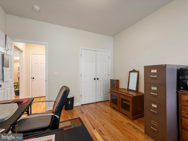 office with light hardwood / wood-style flooring