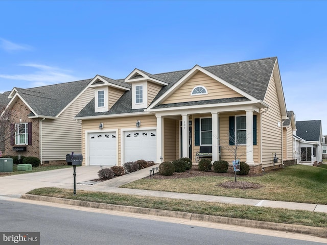 view of front of house featuring a garage and a front yard