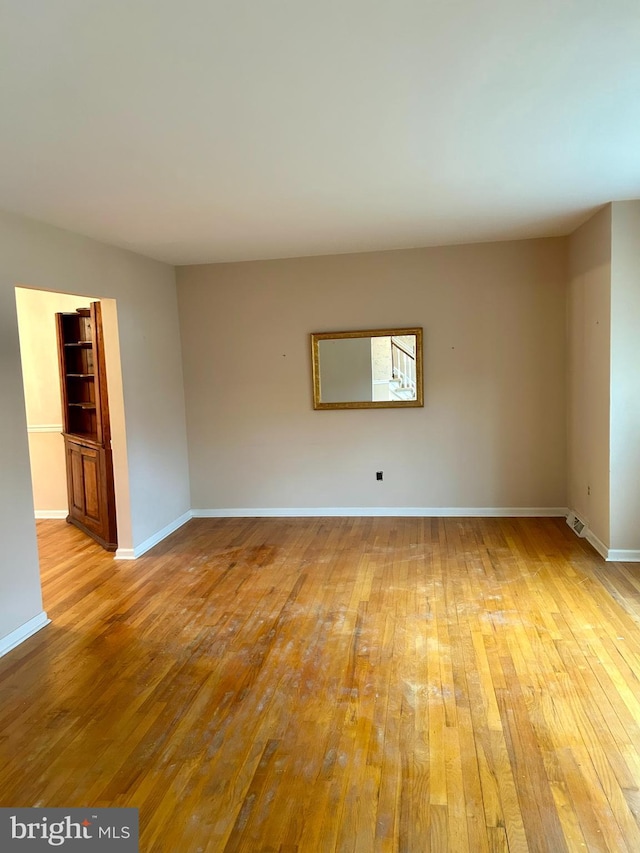 unfurnished room featuring light hardwood / wood-style floors