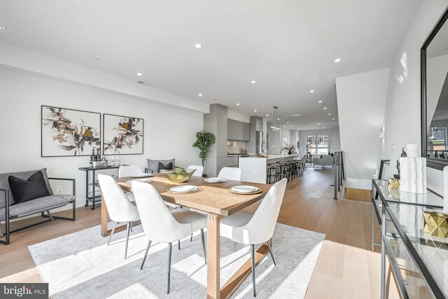 dining space featuring light hardwood / wood-style floors