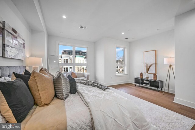 bedroom with hardwood / wood-style floors