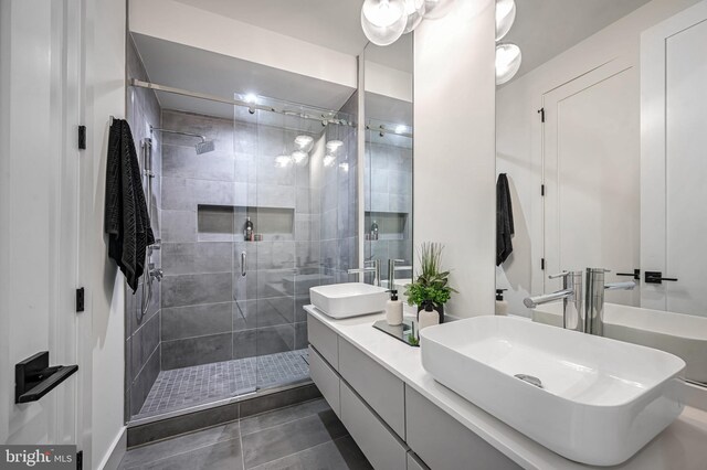 bathroom featuring tile patterned floors, vanity, and an enclosed shower