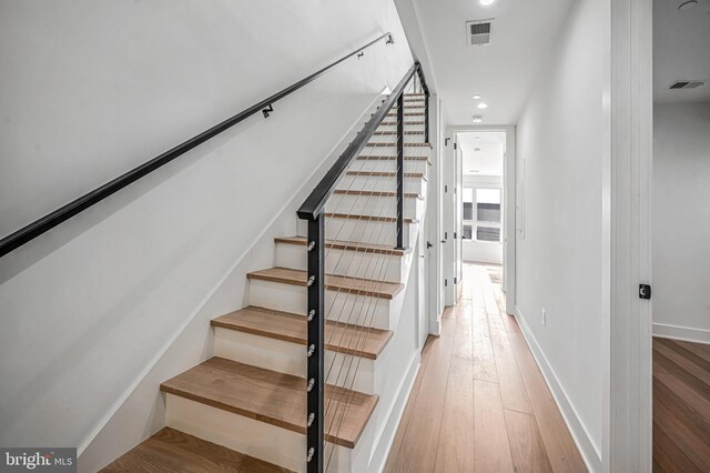 staircase featuring hardwood / wood-style floors