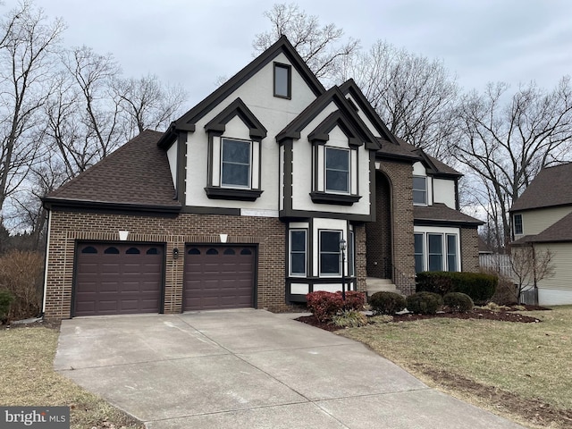 view of front of house with a garage and a front yard