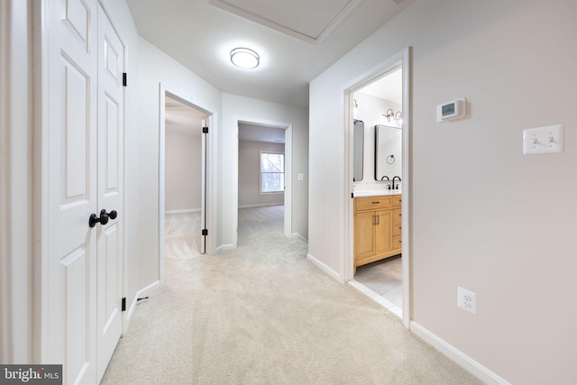 corridor with light colored carpet