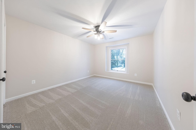 carpeted empty room with ceiling fan