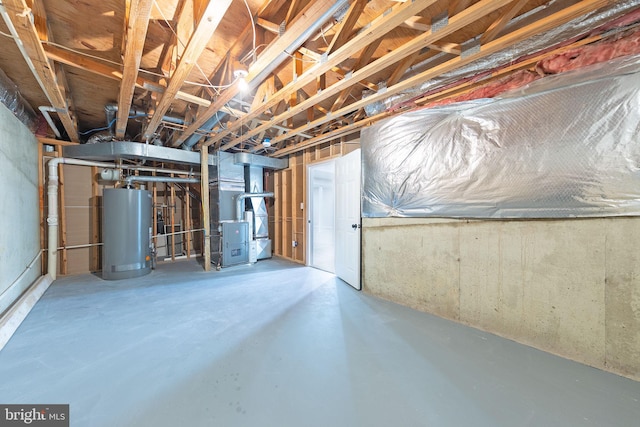 basement featuring heating unit and gas water heater