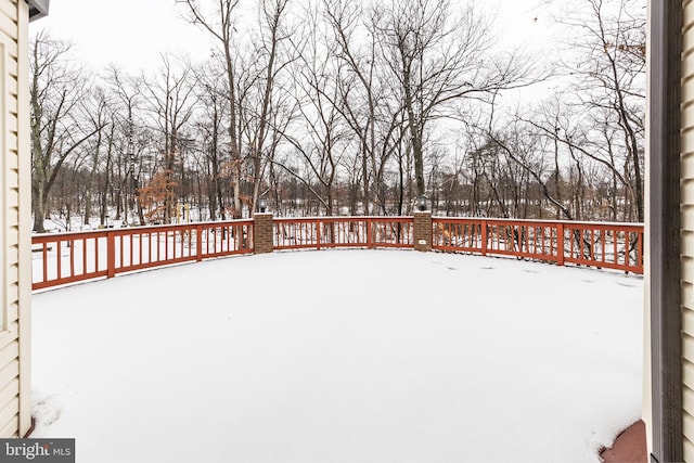 view of snow covered deck