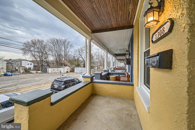 balcony featuring a residential view and a porch