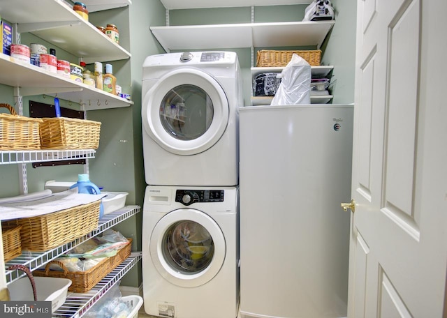 laundry room with stacked washer / dryer