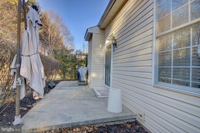 view of property exterior featuring a patio area