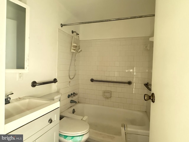 full bathroom with vanity, tiled shower / bath, and toilet