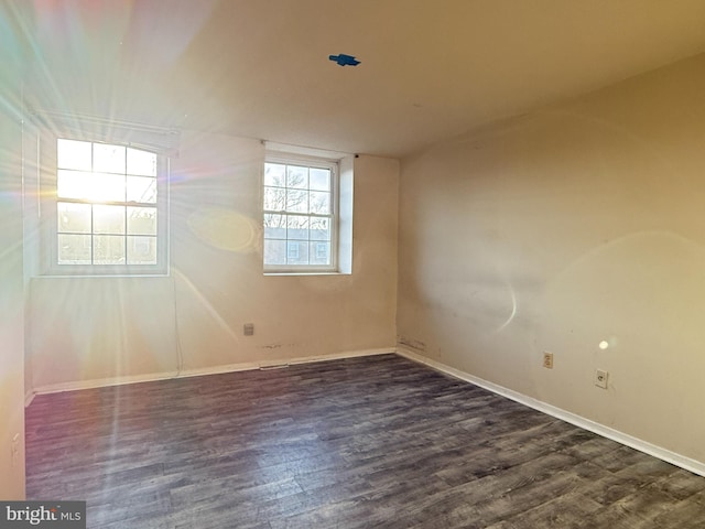 spare room featuring dark hardwood / wood-style floors