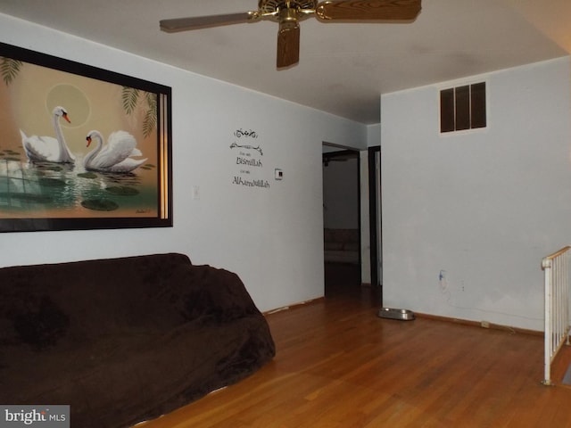 unfurnished living room with hardwood / wood-style floors and ceiling fan