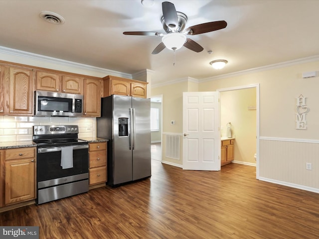 kitchen featuring dark wood-type flooring, crown molding, tasteful backsplash, stainless steel appliances, and light stone countertops