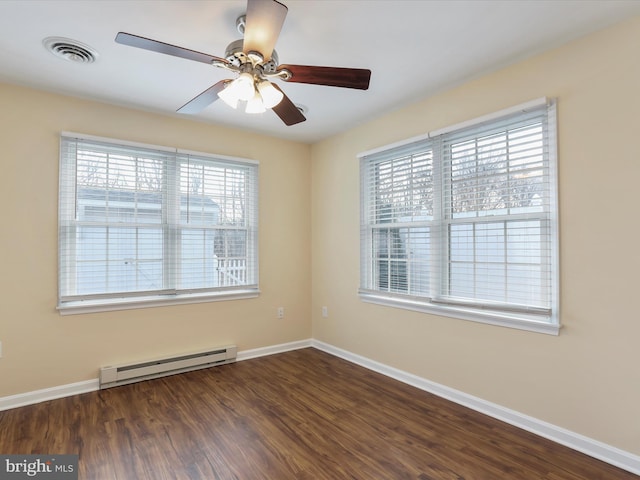 empty room with baseboard heating, ceiling fan, plenty of natural light, and dark hardwood / wood-style flooring