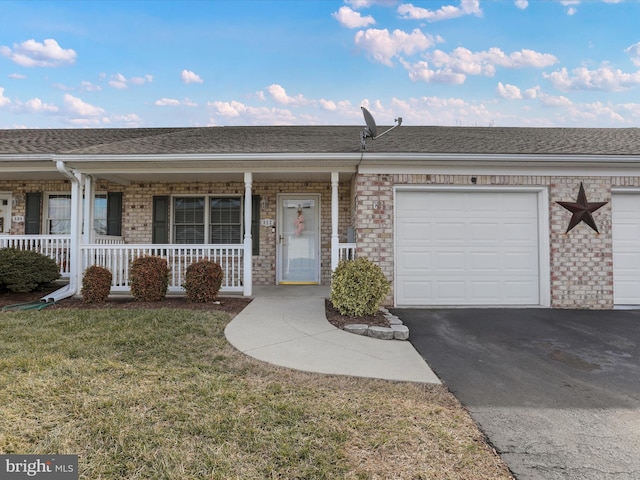 ranch-style home with a porch, a garage, and a front yard