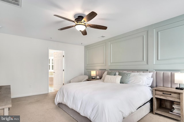 carpeted bedroom featuring ceiling fan and connected bathroom