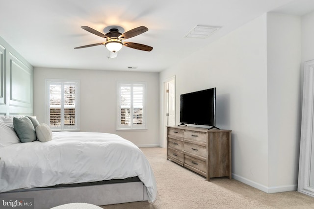 bedroom with light colored carpet and ceiling fan