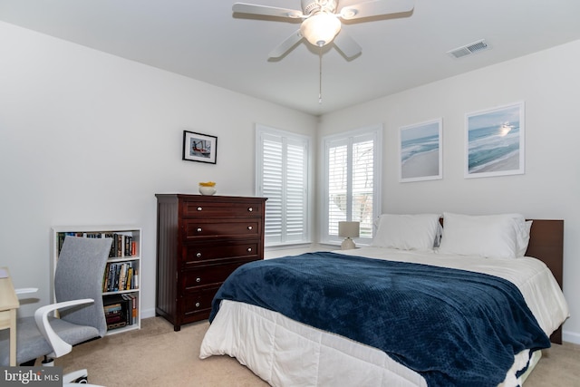 bedroom with light colored carpet and ceiling fan