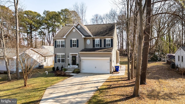 view of front of home with a garage and central AC unit