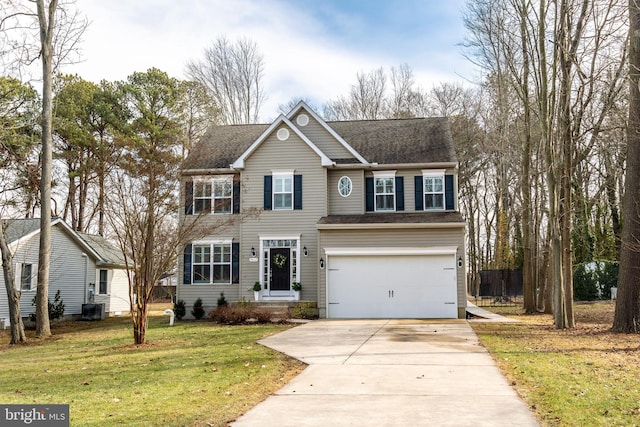 view of front of property featuring a garage, central AC, and a front yard