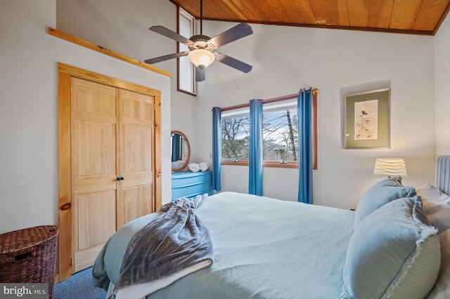 bedroom with vaulted ceiling, wooden ceiling, a closet, and ceiling fan