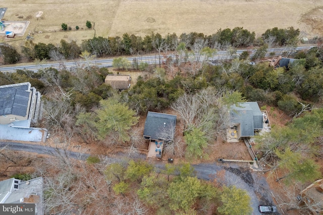 birds eye view of property with a rural view