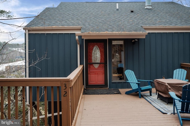 entrance to property with a wooden deck