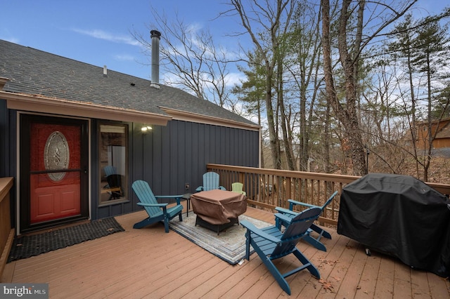 wooden deck featuring grilling area