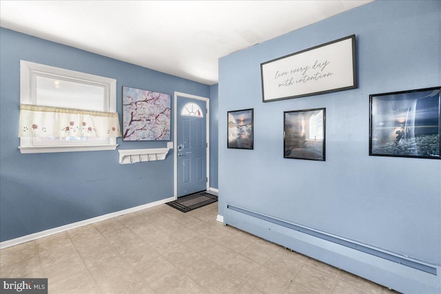 interior space with a baseboard radiator and a wealth of natural light