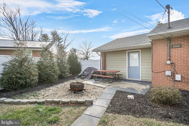 view of yard featuring a patio and a fire pit