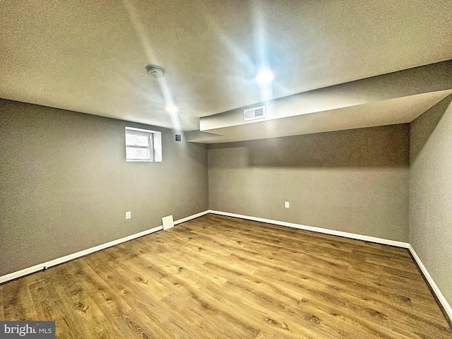 basement with wood-type flooring