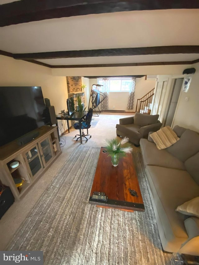 living room featuring beamed ceiling and carpet