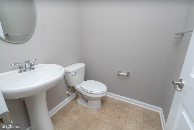 bathroom with sink and toilet