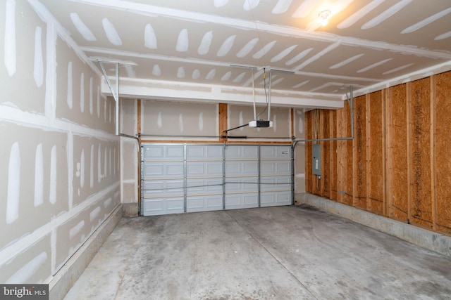 garage featuring a garage door opener and electric panel