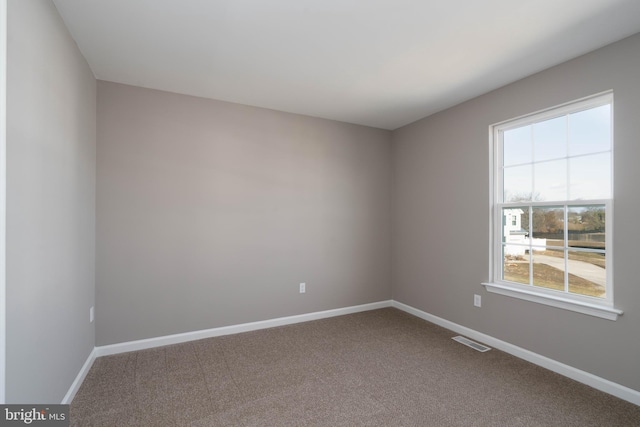 view of carpeted spare room