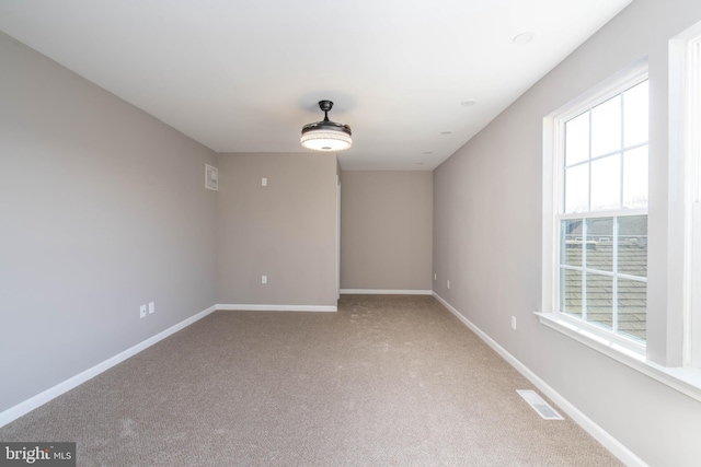 empty room with carpet flooring