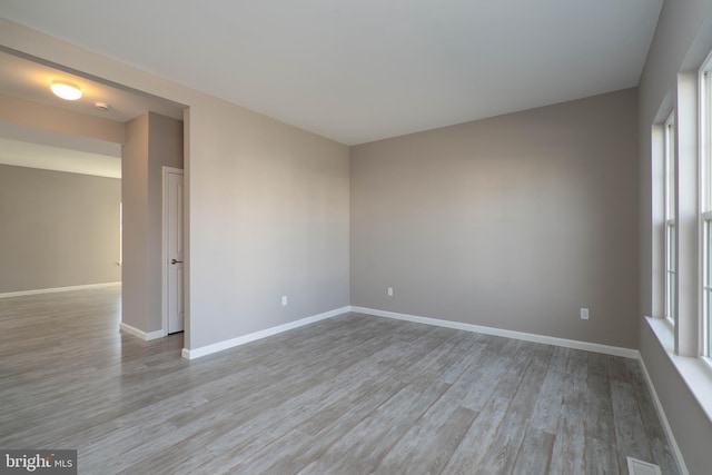 spare room with light hardwood / wood-style floors