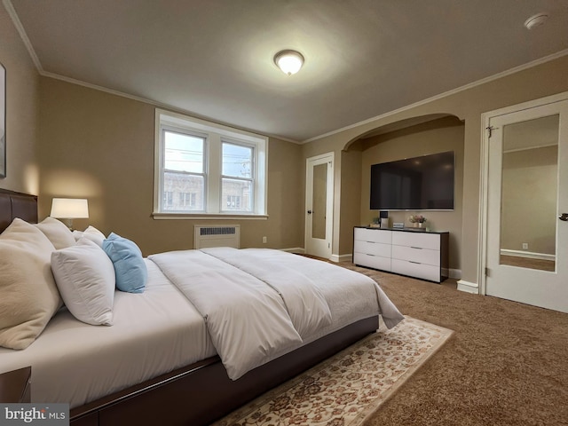 carpeted bedroom featuring crown molding and an AC wall unit