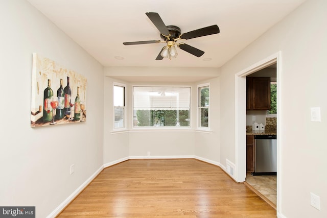 interior space with ceiling fan and light wood-type flooring